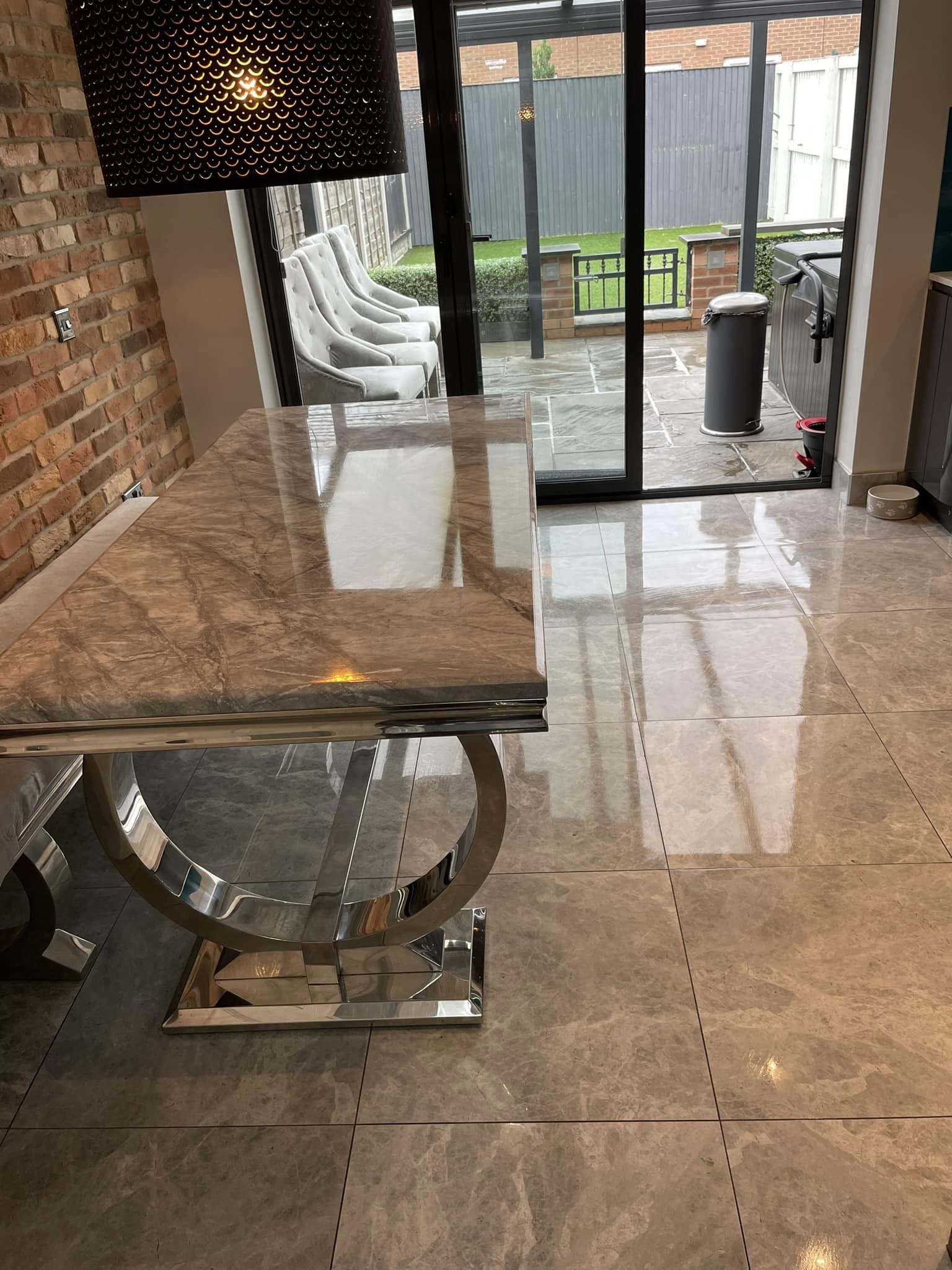 Very shiny grey table and tiles