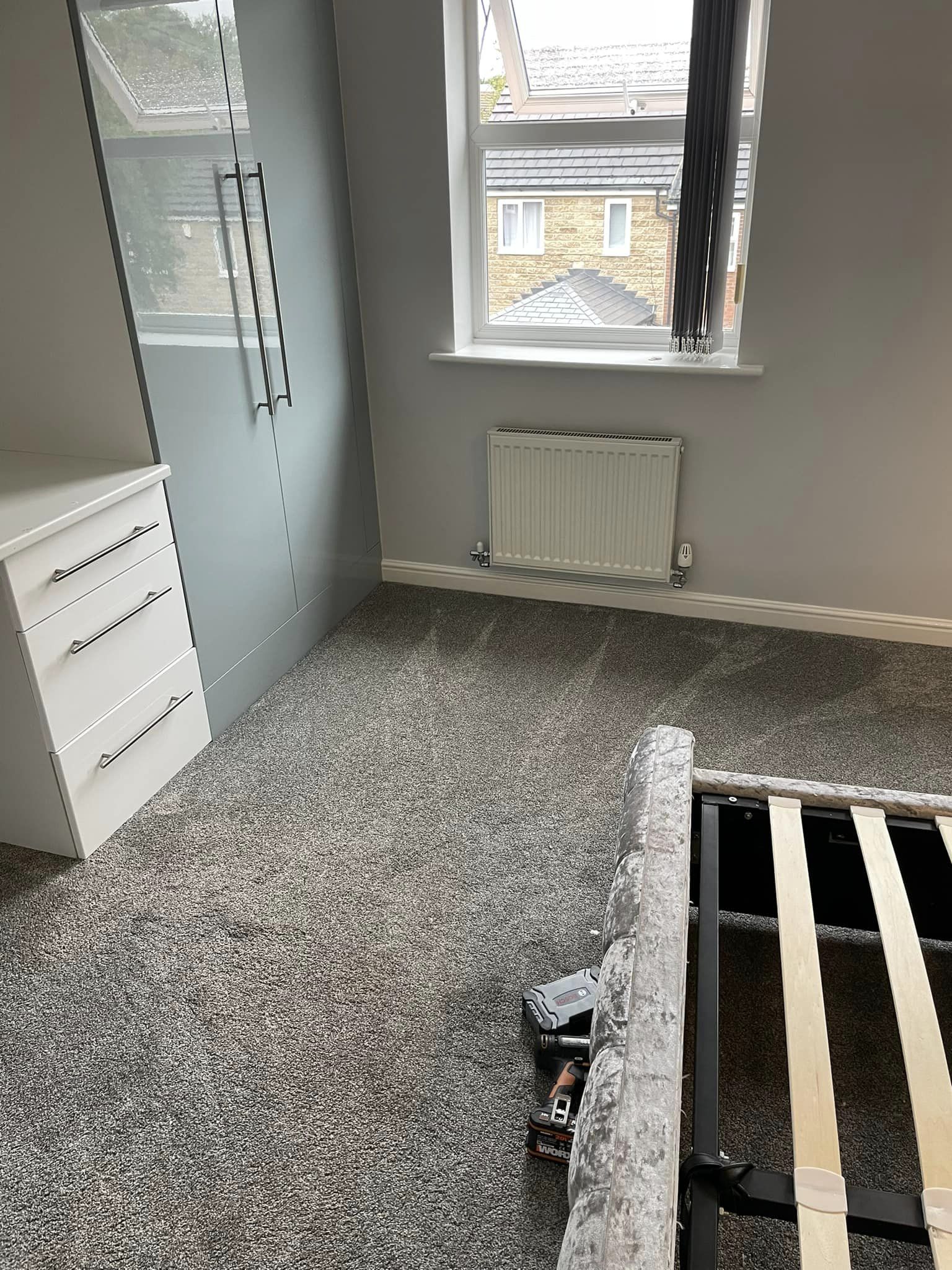 Fresh grey carpet with drawers and cupboards